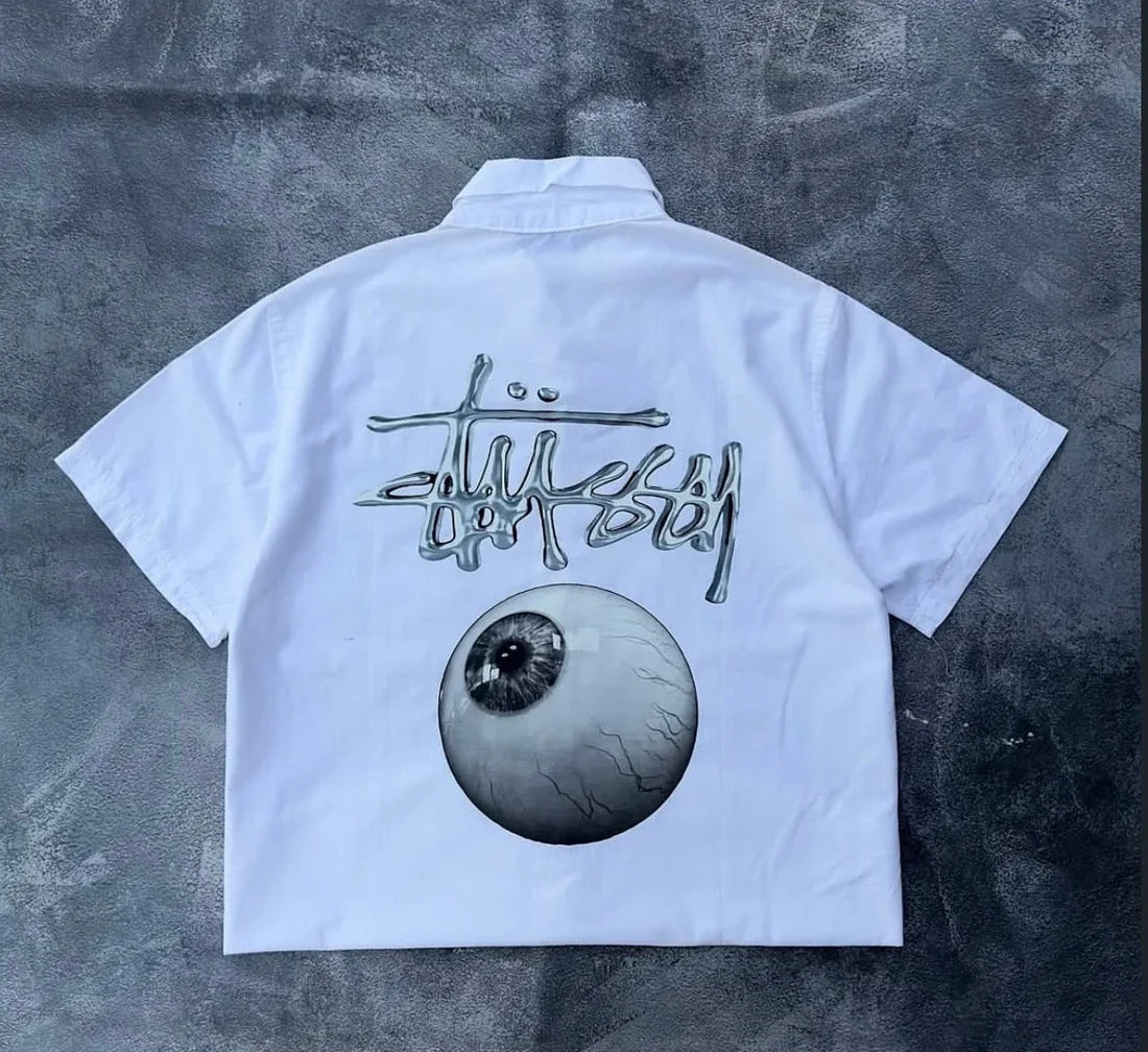 White Stüssy cropped cotton shirt featuring large eye graphic and signature logo print on back