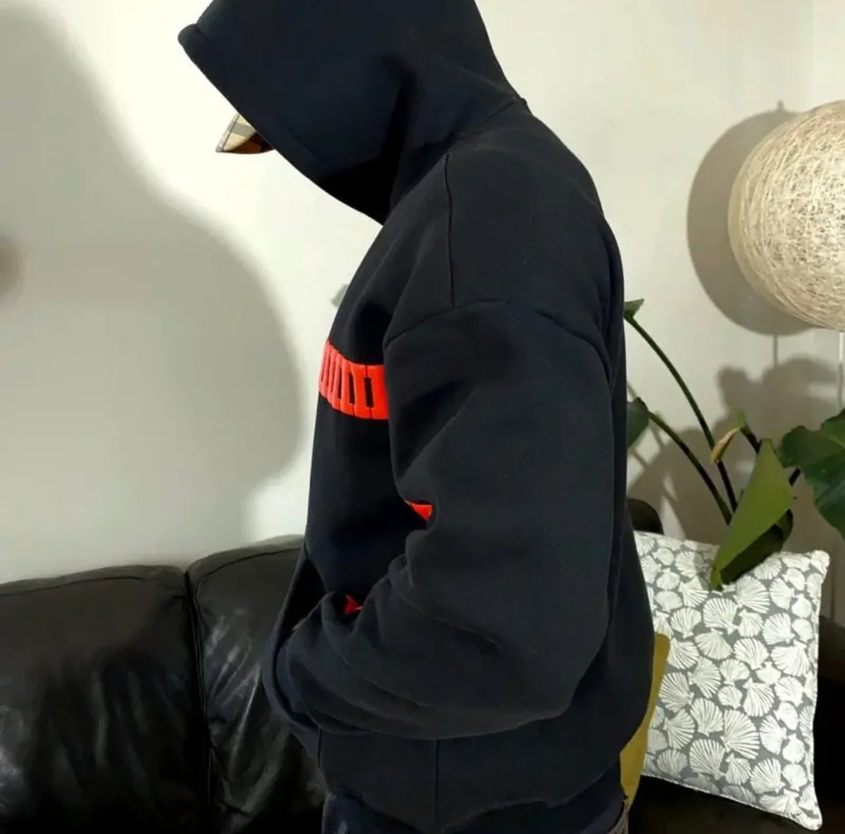 Model wearing Section Zero black oversized streetwear hoodie